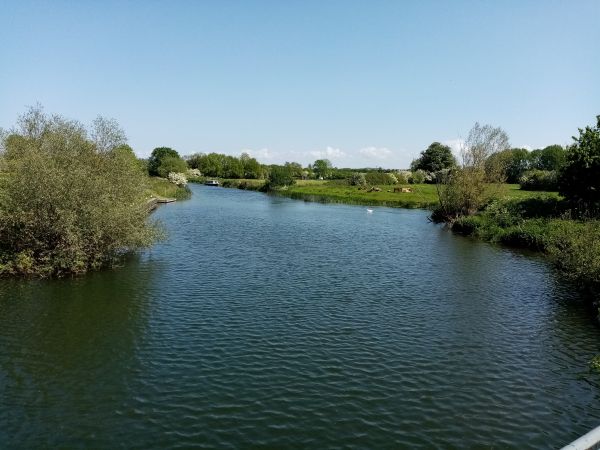 The river at Oundle showing both banks and a clear blue sky